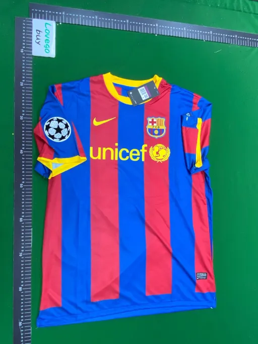 1011 champions league champion barcelona home jersey, size 10, messi print + captain's armband